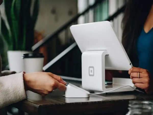 Client reviewing financial advisor ratings and testimonials on a tablet device
