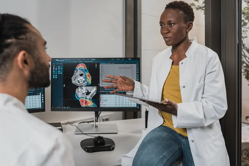 Medical professional consulting with patient in a modern clinic setting